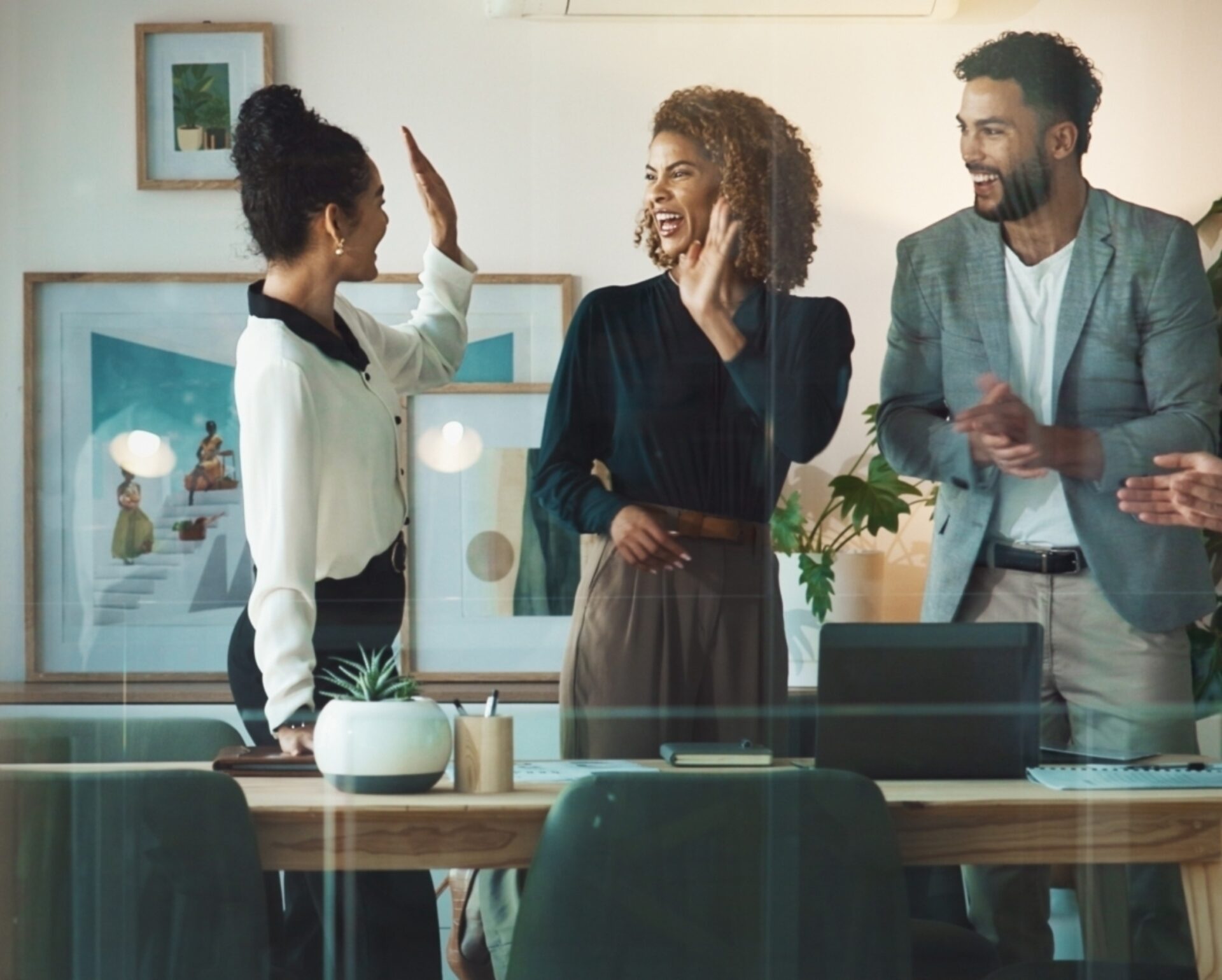 Collaboration,,High,Five,And,Success,With,Business,People,In,Office