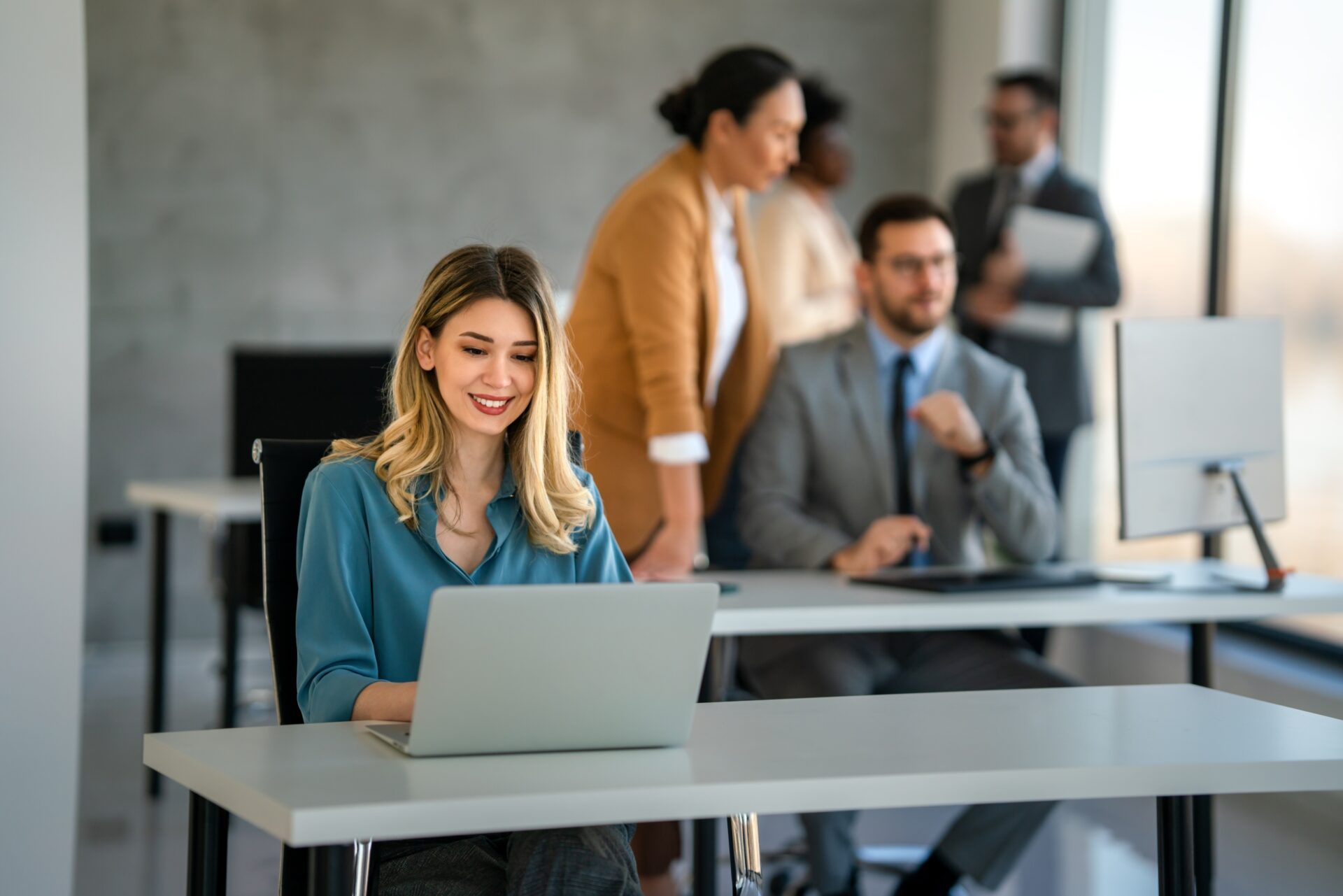 Young,Happy,Successful,Business,Woman,Working,With,Laptop,In,Corporate