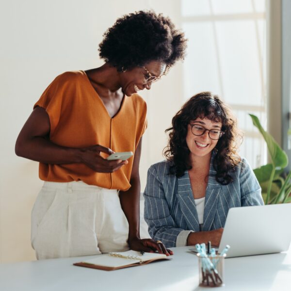 Happy,Professional,Women,Collaborating,With,Enthusiasm,In,A,Modern,Office