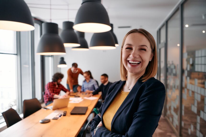 Confident,Blonde,Businesswoman,Leading,Team,In,Modern,Office,Setting.